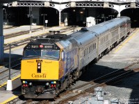 VIA "Operation Lifesaver" F40PH-2 6411 backs 83's train of five stainless steel Budd "HEP" cars into Union Station and under the train shed on Track 9. The shiny yellow nose was probably a recent development, as the unit previously had some OLS & sponsor logos on it.
<br><br>The extra pair of horns at the front was the first application of this feature on VIA F40's, which would be fully adopted during the rebuild program. The front two horns are emergency horns, normal horn use is through the nearly invisible one in front of the first rooftop fan.