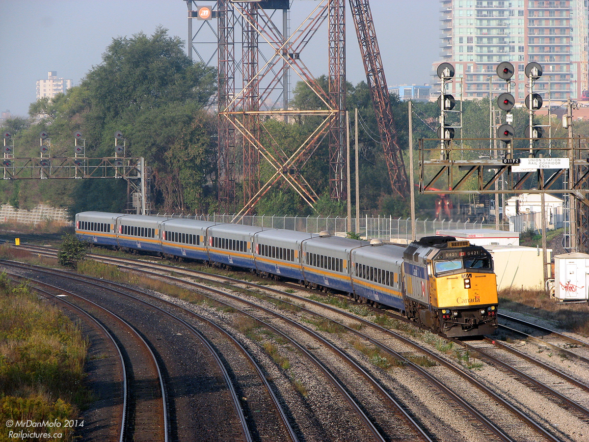 During the peak of morning rush hours, VIA 82 pulls into the Union Station Rail Corridor off the Oakville Sub at Bathurst Street, with VIA F40PH-2D 6421 leading 7 LRC cars full of passengers destined for Toronto Union Station.