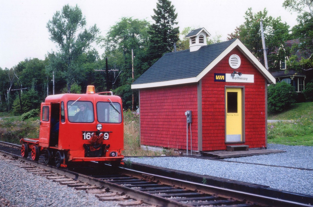 Back before trucks became the common method of rail travel for MoW personnel, these little "putt-putts", or MotorCars, were as common as flies on a summer day around the railroad systems of North America. I recall them referred to as "jiggers" which, once they became motorized, were known as "speeders" due to the fact they now ran faster motor-powered than "human powered". One thing we can call them is "relics of yesteryear" as the only ones existing now are in the hands of collectors & museums. Motorcar clubs are very popular. Members gain permission from certain railroads and groups of 10-20 vehicles will go on "tours of the line". In this image, however, the MotorCar was still a very necessary method of transport....note supply trailer behind the power for carrying tools and other equipment. The VIA waiting room pictured is rather quaint. It was brought in when the original Rothesay station, one of the oldest in Canada dating from 1859-1860, was closed and became a National Heritage Structure in 1976. The little waiting room is still in situ, despite the last passenger train departing the line back in 1994.