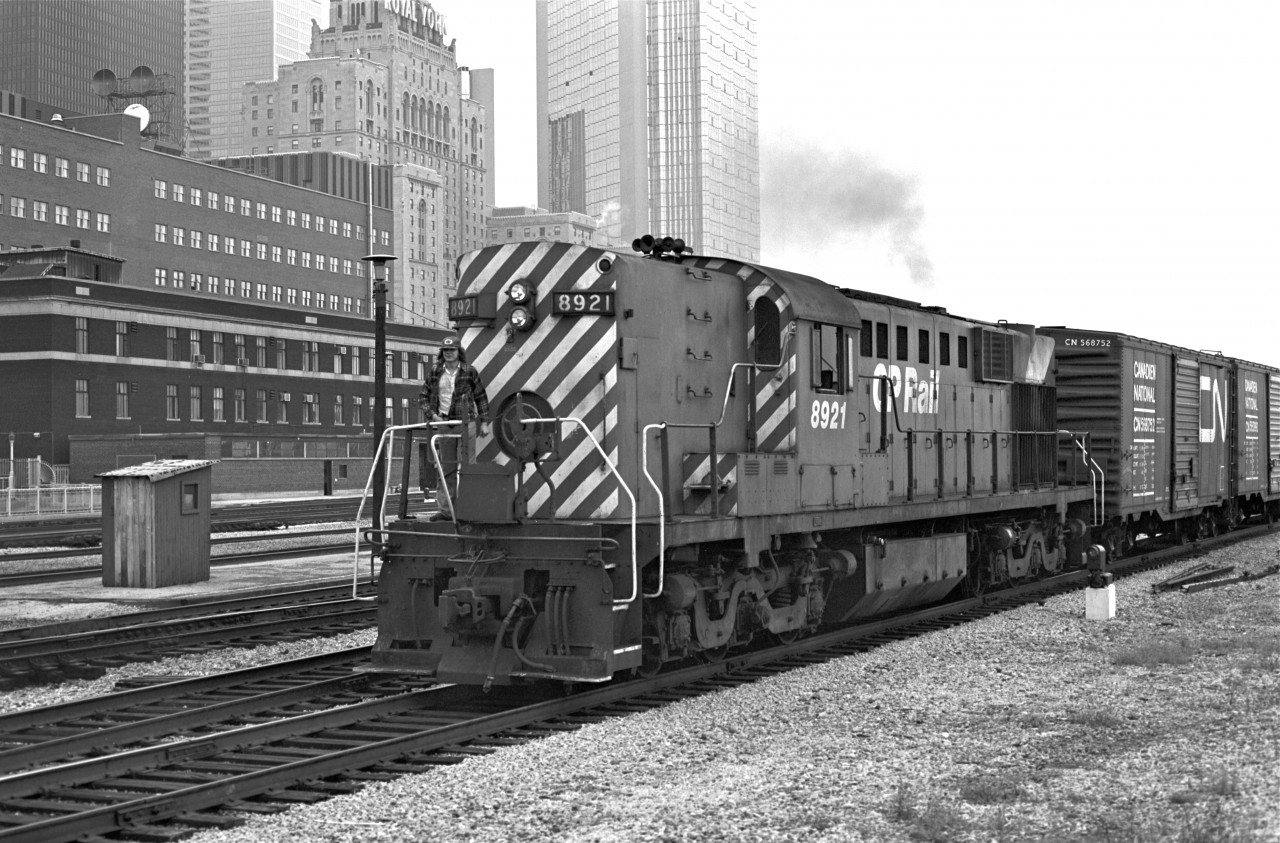 It is no secret that the "Empress of Agincourt" is a very special diesel. Manufactured in 1957, by the Montreal Locomotive Works (retired in '95), it is a one-of-a-kind RSD-17.  Here she is in 1976 - 12 years before being subjected to her Nose Job.  I used to enjoy watching 8921 run regularly past my house on her way up to the Agincourt Yard.  Here she is outside of Union Station in downtown Toronto.  I'm glad that she found a good resting spot at the Elgin County Railway Museum.