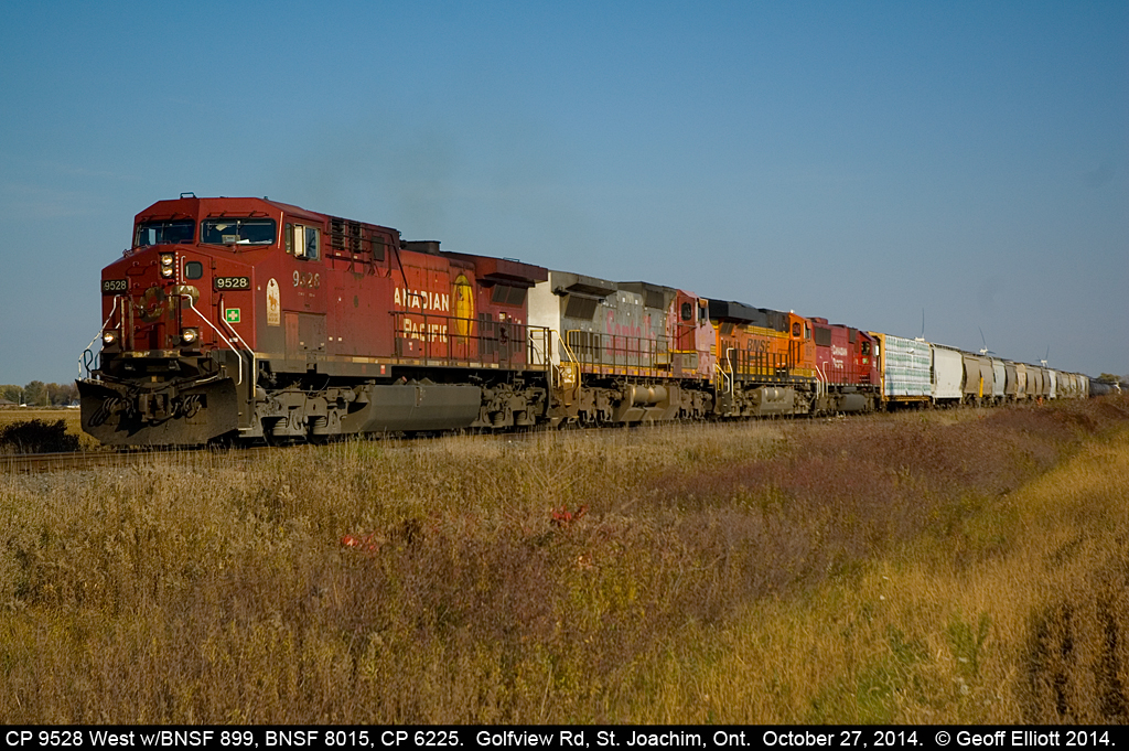 CP 9528 leads a HUGE westbound with a colorful lashup including BNSF 899, BNSF 8015, and CP 6225 as they approach Belle River, Ontario at Golfview Road crossing.