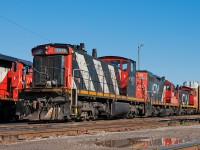 What year is this anyways ? My consist awaits 553's departure out of the oil siding.