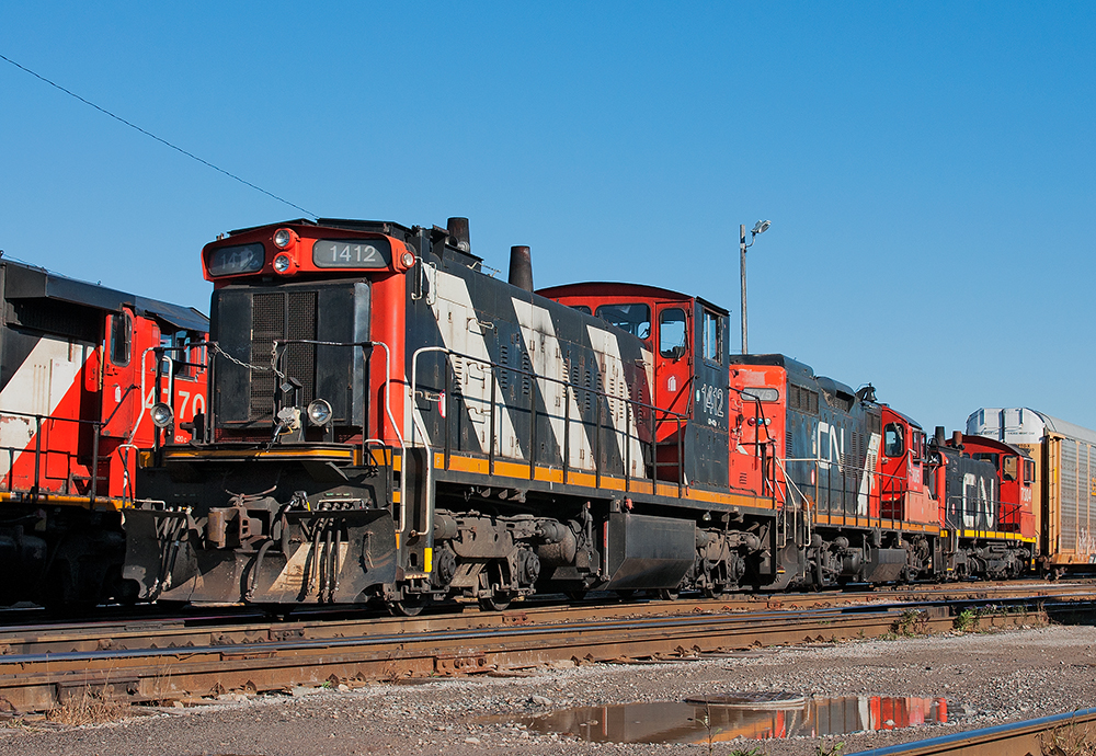 What year is this anyways ? My consist awaits 553's departure out of the oil siding.