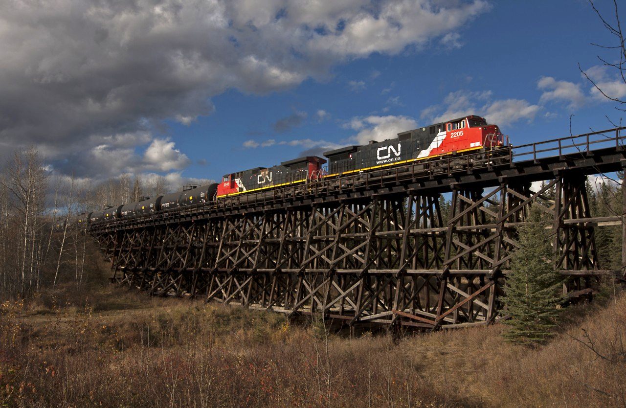 Unit oil train rolls over the trestle at Fawcett Alberta with 2 big GE's in charge.