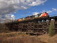 Unit oil train rolls over the trestle at Fawcett Alberta with 2 big GE's in charge.