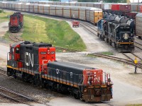 Busy morning in Sarnia...
IC 1010 - IC 1019 - GTW 4920 sit lashed together on what would become M33031 08 (sans GTW 4920)
as yard job pulles down with CN 7264 - CN 277