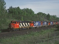 A Grand Trunk Western sandwich! CN 9504 leads an eastbound between Milbase and Speyside on the Halton Sub, assisted by 3 GTW locos and a 2nd GP40-2W.