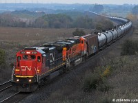 A slight kiss of sun brightens the power on westbound crude empties at Newtonville. CN 2131 and BNSF 5780. 1722hrs.