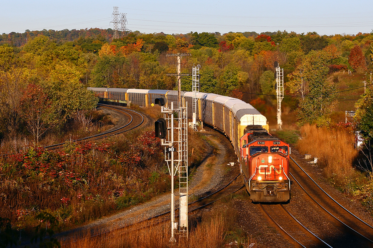 Not long after sunrise, CN 394 comes down the hill behind CN 5739-5433. I probably would have otherwise missed him, but the train had been delayed slightly at mile 5 after bringing CN 385's conductor from the head end to its' tail end to inspect the SBU after that train developed air problems and went into emergency. A broken valve in one of the locomotives was later found to be the cause.