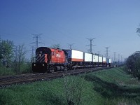 CP Rail C-424 4213 leads the short-lived #909 train through the Hornby dip approaching Milton. #909 was a Toronto - Windsor TOFC train, which I believe was run primarily for one of the trucking companies. 