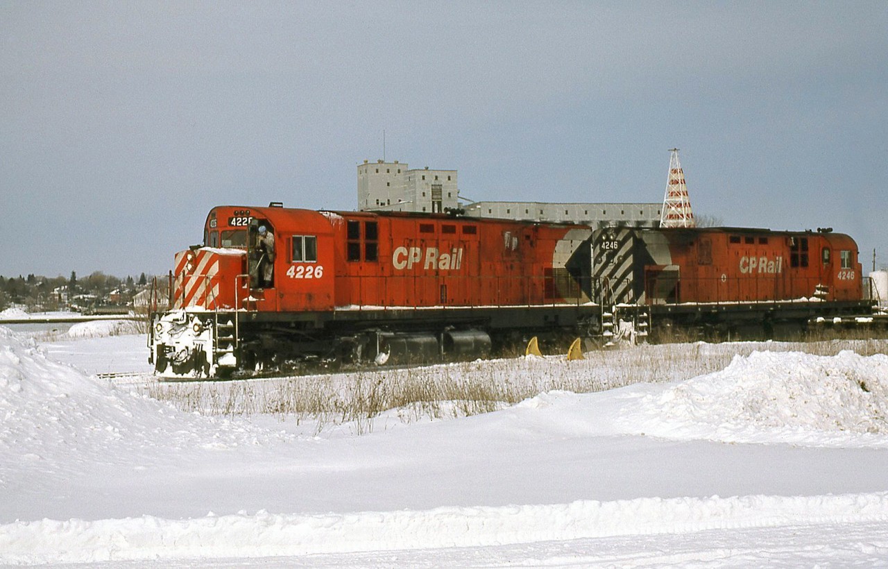 CP 4226 and 4246 at "the end of the line" - Owen Sound ON, the northernmost part of Canadian Pacific's Owen Sound Sub line from Streetsville to Owen Sound. MLW C424's were common road power on the Owen Sound Sub, Orangeville Sub and neighbouring lines, having been converted from DRF (Diesel Road Freight) or DRS (Diesel Road Switcher) units with the addition of rear lighting, numberboards, pilots. Note the reversed radiator grill section on trailing 4246, resulting in an odd-looking multimark.

The last train out of Owen Sound was on October 31st 1995, and CP abandoned and removed the entire line between Owen Sound and Orangeville not too long after (this section was originally built by the Toronto, Grey & Bruce). When the remaining section from Orangeville to Streetsville (originally built by the Credit Railway) was threatened, the line was purchased from the CPR by the town of Orangeville for continued operation in 2000.