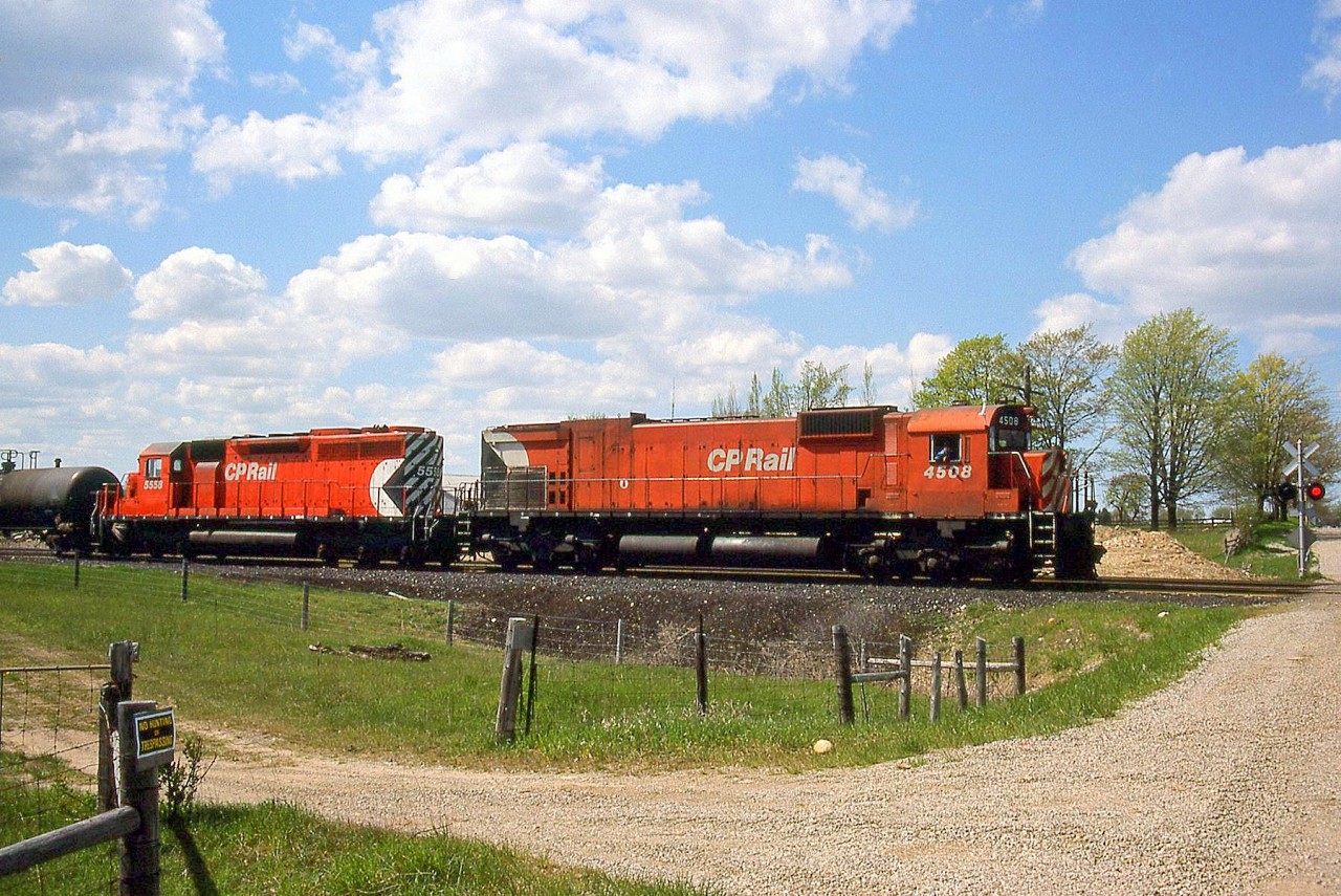 CP M630 4508 and SD40 5558 roll eastbound at Orr's Lake on the CP Galt Sub, with white extra flags waving on the lead unit.

4508, the first M630 build by MLW for CP, would be retired in 1993 and stripped for parts. 5558 would be retired and sold in 2000, to be rebuilt as leaser GCFX 3090 (and it would make a few appearances on CP).