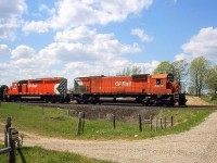 CP M630 4508 and SD40 5558 roll eastbound at Orr's Lake on the CP Galt Sub, with white extra flags waving on the lead unit.
<br><br>
4508, the first M630 build by MLW for CP, would be retired in 1993 and stripped for parts. 5558 would be retired and sold in 2000, to be rebuilt as leaser GCFX 3090 (and it would make a few appearances on CP).