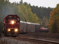 After meeting the 8891 S at Baxter, the 5866 N throttles up the grade at Midhurst with clearance to Mactier.