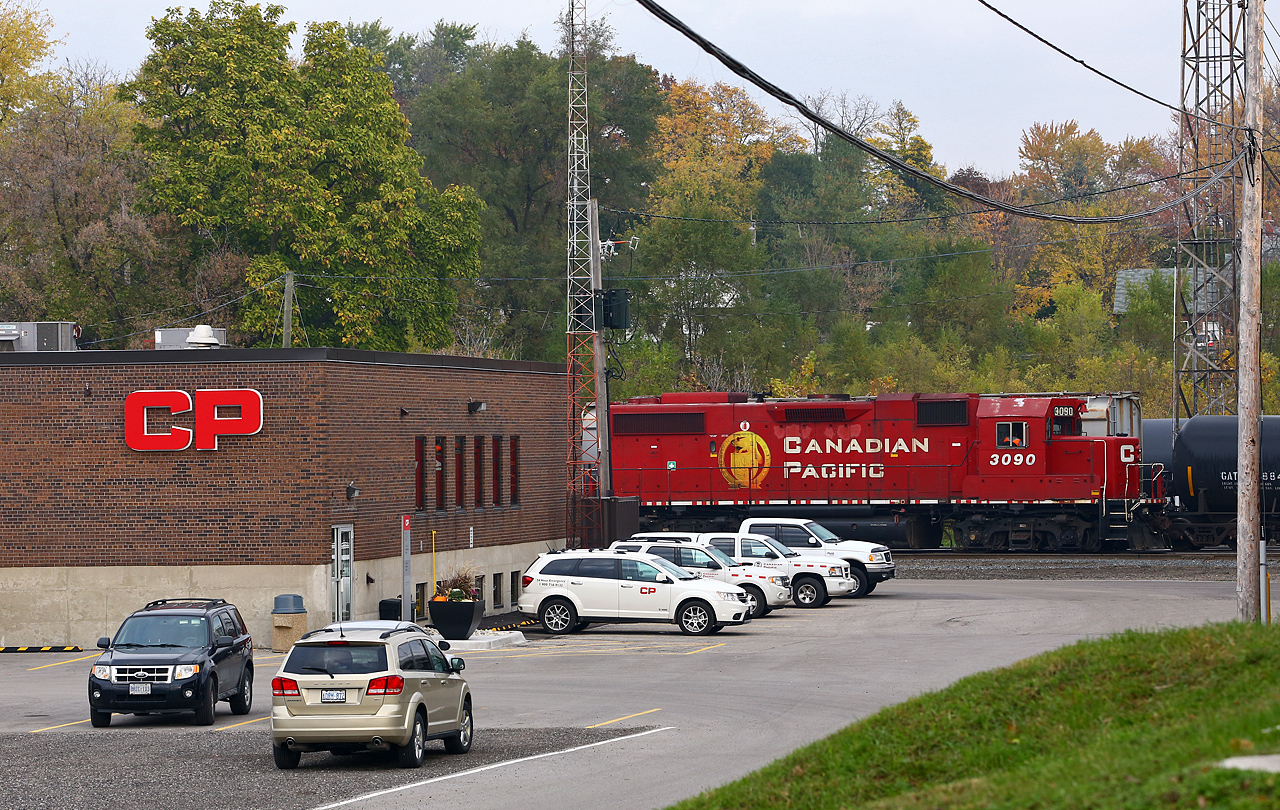 Despite going to great lengths to rebrand the company, one of the road's few remaining Beaver logo GP38-2's can be found switching out cars at Quebec Street yard. Now "CP" instead of Canadian Pacific, the new corporate identity has already been applied to the 1960's vintage yard office and a few company vehicles. The sharp-eyed observer will notice a pumpkin as well as other staples of the fall harvest sitting in the gigantic flowerpot out front of the office building. In this new era of precision railroading, one has to wonder what the company accountants think of seeing flowerpots on an expense report...