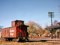 CP 437136 waits out the weekend in front of the Peterborough station. Ex CPR 4-6-0 1057 was to arrive later on an excursion but was short turned at Dranoel due to a running gear issue. The station lost it's canopy a few years later. The schedule board for Dayliner service probably went at the same time. The caboose was preserved in White River. Some details in this photo, 437136 is sporting a backup whistle. The silver post in front of the canopy was the "circuit end" sign for the crossing of George Street. Behind the caboose is Rehill Building Supply which still had a siding and coal pile. Photo probably taken by my Mother with editing assistance by the RP folk.  