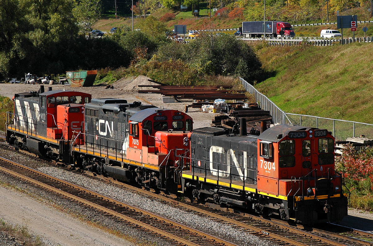 L55431 09's power (CN 1412 - CN 7075 - CN 7304) backing into Aldershot after arriving from Oakville and cuting away from it's train....where else can you get a consist like this but CN ?? :)