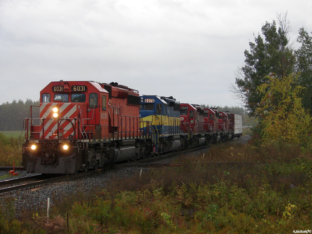CP 6031 North with train 421-08 from Toronto pulls ahead with 1 loaded centerbeam to set-off in the yard at Utopia for the BCRY in a wet, and blustery scene. Tonight's 421 consists of CP 6031/DME 6370/CP 5943/CP 6608/CP 6601 and 133 cars after setting off here, I'll take it in late 2014!!!