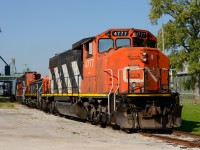 CN4777 with slug 242 and CN7230 switch cars at the Cargill elevator in Sarnia.