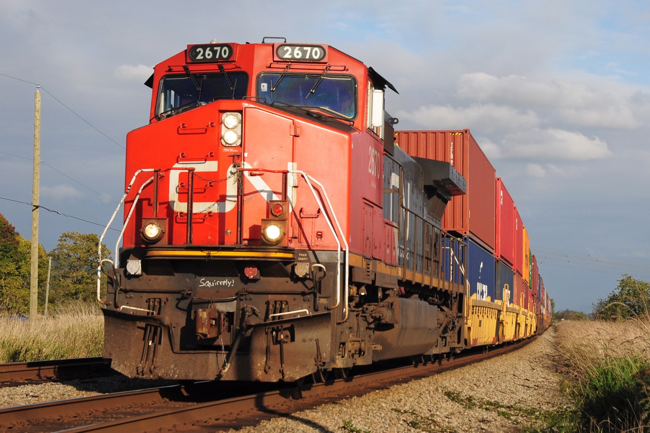 CN GE C-449W 2670 leading CN102, seen passing by Colebrook on its way to Roberts Bank.
