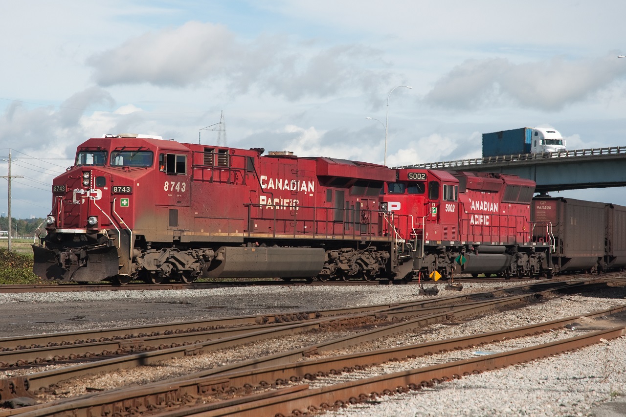 CP ES44AC 8743 leads a coal train with CP SD30C-ECO 5002 into Roberts Bank in Delta, BC.