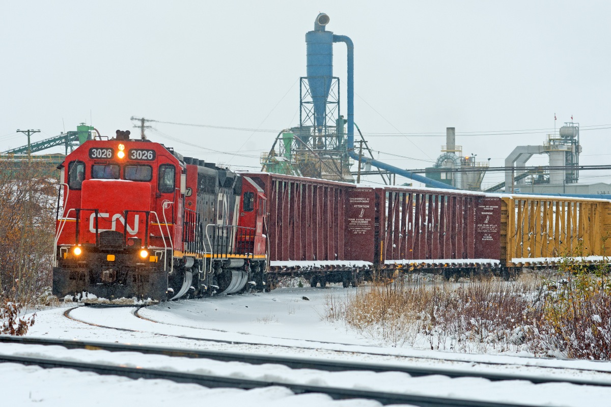 Winter is here… well in northern BC anyway.  WC 3026 and 3027 go about switching Canfor as the snow falls in Fort St John.