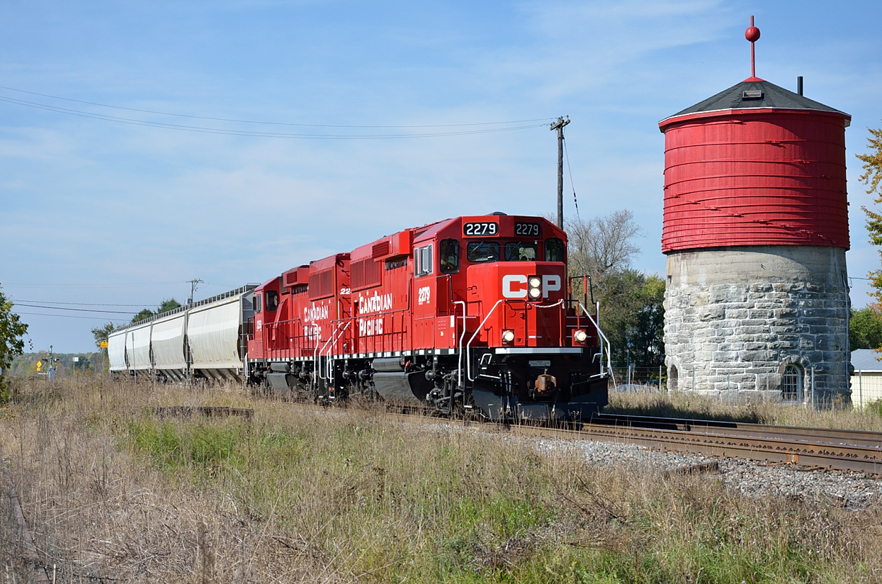 The de Beaujeu turn from Smiths Falls flys by the water tower at Dalhousie at a speed that would have been the envy of VIA.