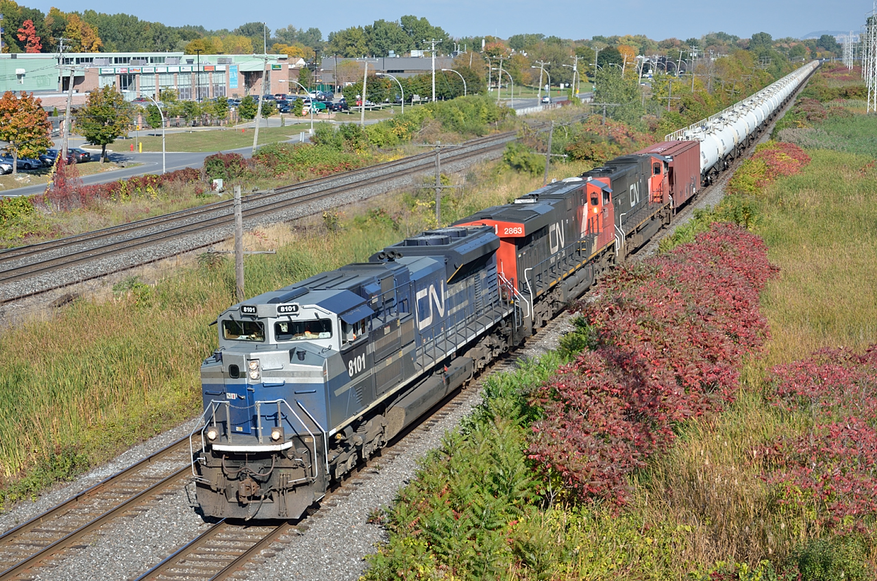CN 711 carrying the Brockville Tank-Train on its head-end passes through Pointe-Claire.  One locomotive and the Tank-Train will be set off at Coteau, turned and will continue to Brockville with a new crew.