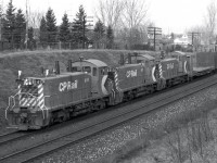 Here is where it all began... at the back of my yard!  I spent many hours here watching the trains work their way from Toronto up the hill towards the Agincourt Yard.  Over the years, I got to know the faces of many of the engineers.  They would give me a friendly blast when they saw me waving.  Sometimes I would be in my bedroom and I'd hear a couple of short bursts on the horn... the engineers like Mac Allen just sayin' hello.  It has been many years since I've lived there, but I sometimes wonder if even today there are other young teenage boys watching and photographing the trains as they go by. 