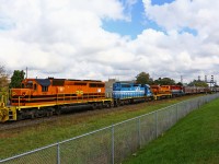 A day that was otherwise grey and gloomy finds GEXR 433 making a rare daylight move off the west end of the Guelph sub to interchange their train of mostly KBSR hoppers to CN. Typically run through the night, it's difficult to catch the GEXR in action in London, especially now that EMD is gone. The consist on this day featured both of GEXR's G&W painted locos (3393, 2303), as well as GSCX 7369 and RLK 4095. 