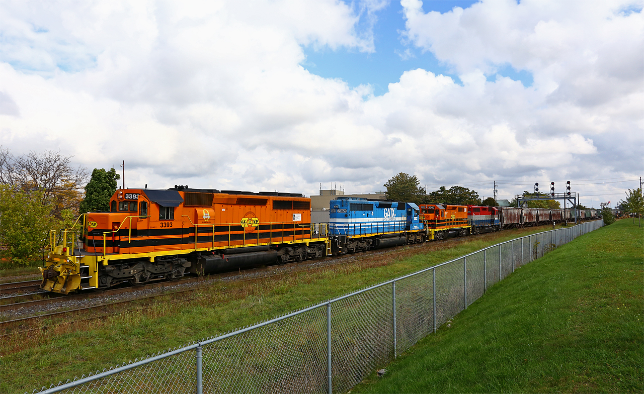 A day that was otherwise grey and gloomy finds GEXR 433 making a rare daylight move off the west end of the Guelph sub to interchange their train of mostly KBSR hoppers to CN. Typically run through the night, it's difficult to catch the GEXR in action in London, especially now that EMD is gone. The consist on this day featured both of GEXR's G&W painted locos (3393, 2303), as well as GSCX 7369 and RLK 4095.