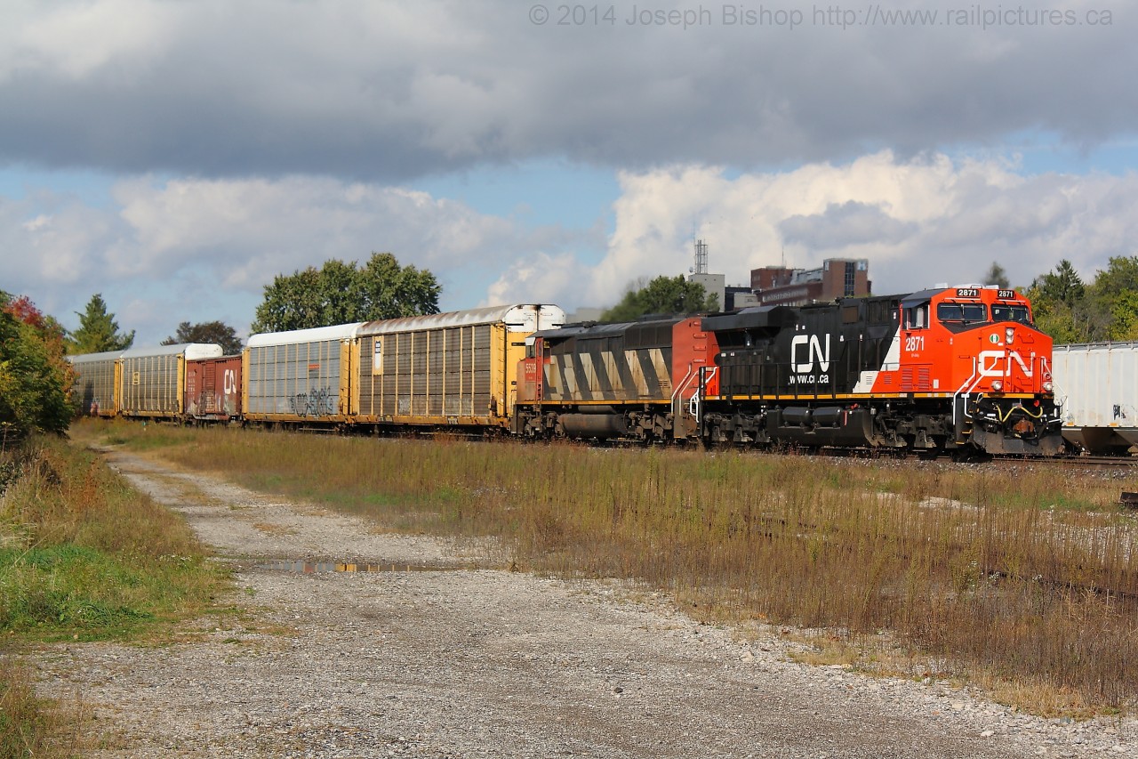 CN 329 cruises through Brantford on a sunny October morning with one of CN's newest GE ES44AC's in the lead.  CN 2871 is only a few weeks old and looked pretty spiffy!