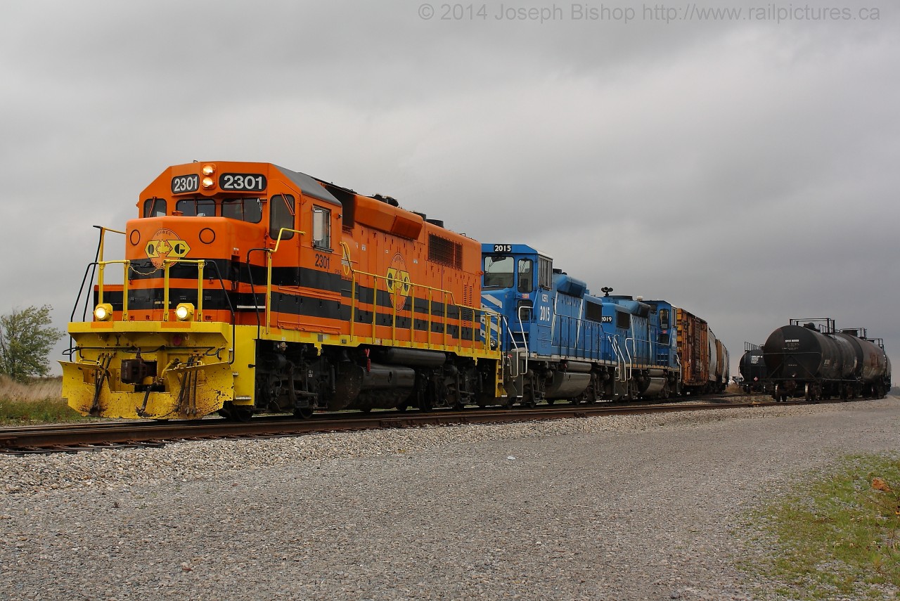 The Nanticoke Road Switcher goes about its morning duties of switching out cars for Imperial Oil in Garnet yard.  Leading the train this morning is the newest addition to the SOR, QGRY 2301 was transferred to the SOR a few weeks ago and is the first of many new units to be coming to the SOR to replace the GP20D's.  Two of four GP20D's that the SOR had are trailing 2301.  It appears that CEFX 2006 and CEFX 2014 are no longer on SOR property and it makes me wonder if this will have been my last time to photograph them on the SOR..