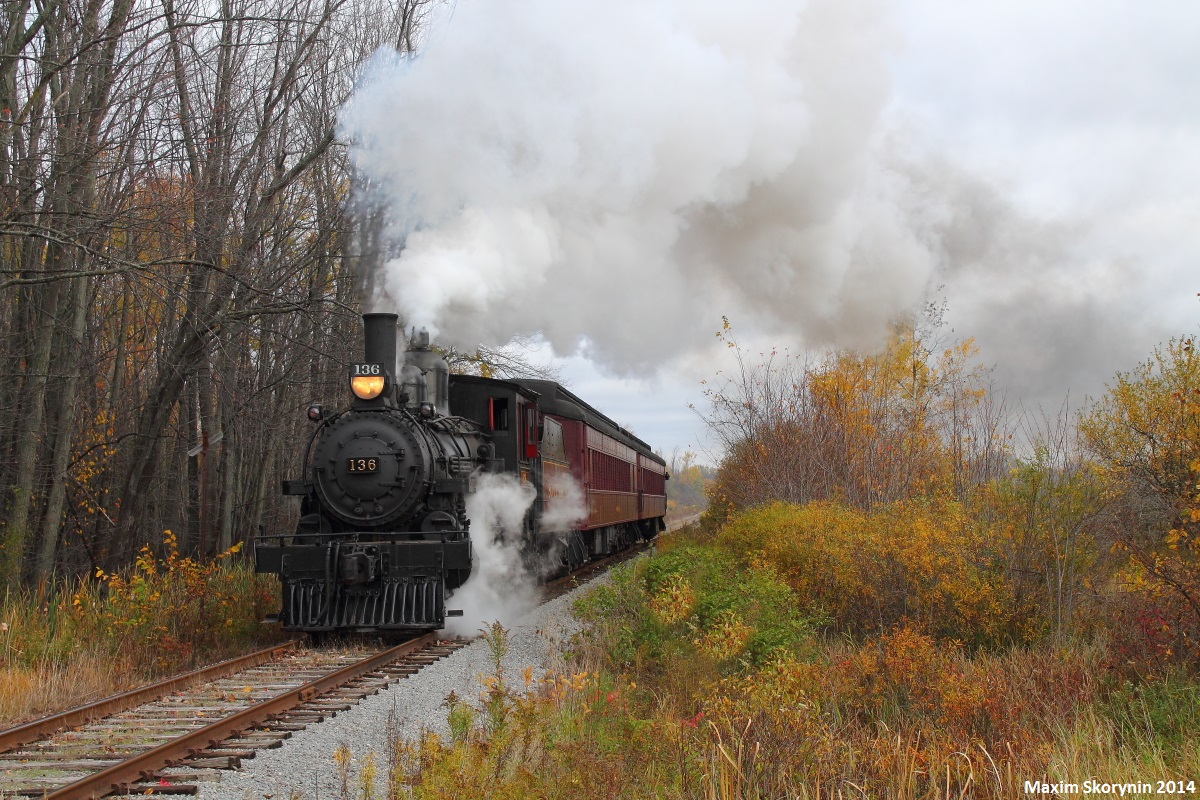 Canadian Pacific locomotive 136, a steam 4-4-0 throttles up the grade with 2 restored 1920's era passenger cars in tow. #136 helped to construct the transcontinental railroad, and was built in Montreal in 1883.