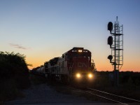 CN 330 knocks out a limited to clear signal doing a full 45mph into the crossover at Jordan. With just minutes of light left, a double Dash 8 lashup powers this train, with CN 2035 in the lead, and NS 8348 trailing. After the last car cleared the block, the RTC quickly realigned the switch for the Amtrak Maple Leaf, which had just left Niagara Falls.