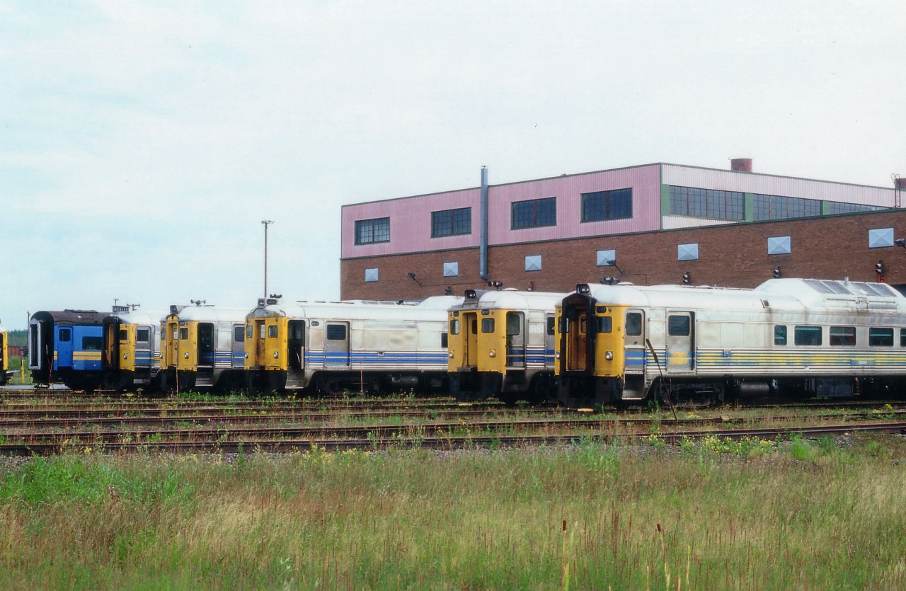 People often think back to where they were and what they were doing when the planes hit the NYC Twin Towers in that famous 9/11 terrorist attack. It was a moment in time never to be forgotten. This wandering soul was on his way to the former CN Diesel Shop in Moncton, New Brunswick, to check out the Industrial Rail Services Inc that now called the old CN Gordon Yard home. The IRSI eventually declared bankruptcy in 2012. Engineers at the plant claimed faults with some of the 98 rail cars they were overhauling for VIA Rail, resulting in the falling behind of the order schedule, and VIA Rail terminated the remainder of the deal in April 2012. Completion of the $109 million contract was handled by CAD of Lachine, Quebec. In this image taken of the south side of the building, one can see some of the old Budd cars sold to IRSI by VIA in 2000.
