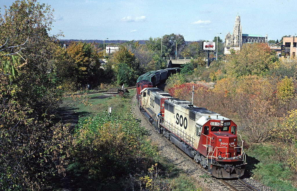 Soo Line SD60 6015 has lead a 398, a grain train, down the grade from Guelph Junction after coming east from London and is stopped in Hamilton for a crew change.