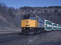 In early 1992 Via's LRC coaches were sidelined with axle (or wheel?) problems. In their place Via used a number of GO Transit bi-levels. Here's #73 passing the former station site at Dundas. 