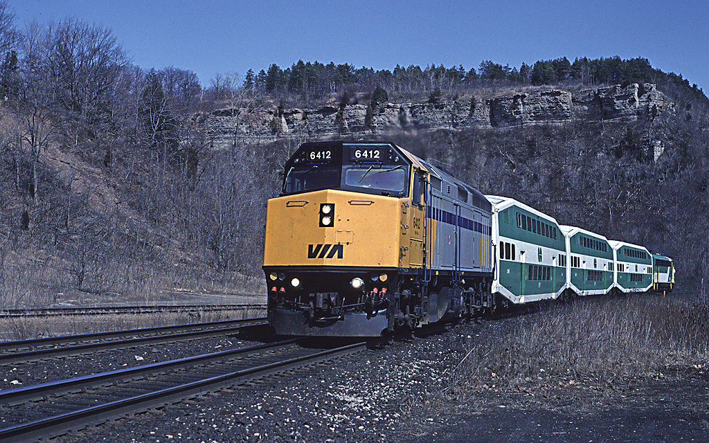 In early 1992 Via's LRC coaches were sidelined with axle (or wheel?) problems. In their place Via used a number of GO Transit bi-levels. Here's #73 passing the former station site at Dundas.