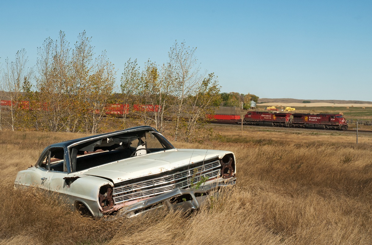 This shot show's the kind of grungy, un-maintaned, almost forgotten, rusty junk, that can be seen throughout much of Canada's prairie land, oh and there's also and old car in the photo too ;)