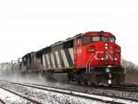 The snow had almost stopped when this eastbound arrived hauling a lot of tank cars. CN 5546 and IC 1009 were in charge of the train.