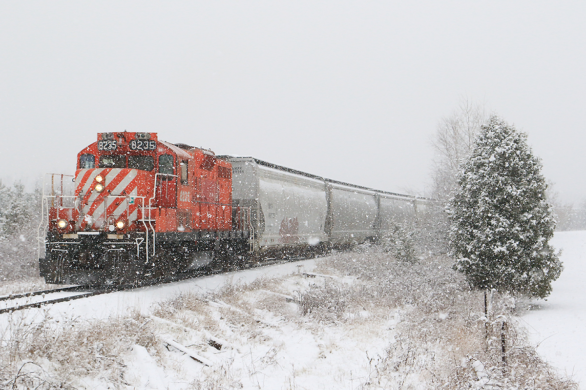 ex CP OSR 8235 takes charge solo with 10 cars in tow. This being the first snow fall that stuck around I just had to to take advantage of it.......who wouldn't ?