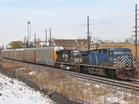 Coming into frame and the sun makes it out just in time! CEFX 1040 & NS 2622 take charge on 240 rumbling through Streetsville.