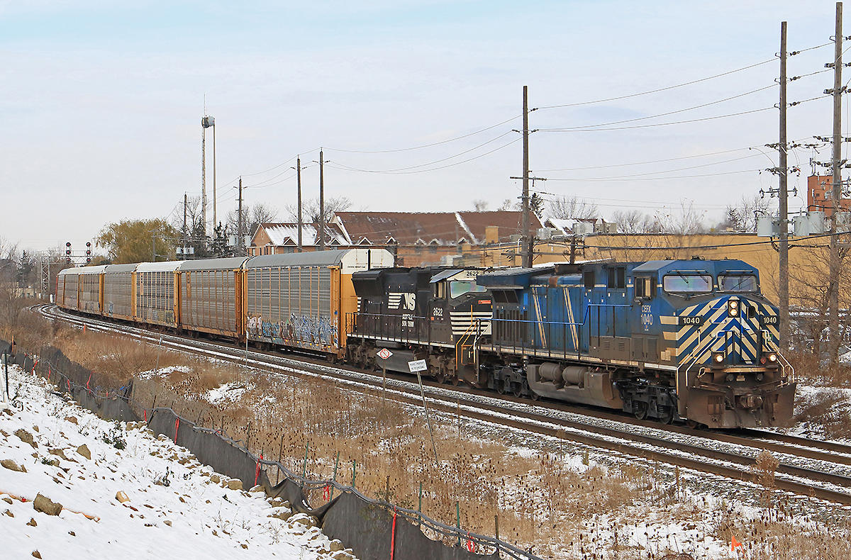 Coming into frame and the sun makes it out just in time! CEFX 1040 & NS 2622 take charge on 240 rumbling through Streetsville.