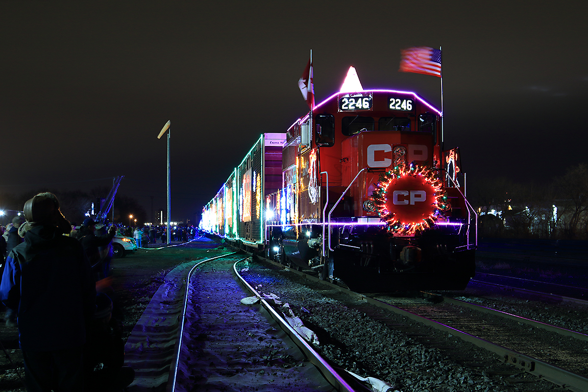 Canadian Pacfic's 2014 Holiday train CP's Canadian Holiday train makes a stop in Lambton yard as the crowd gathers on both ends of the train, some up front to check out what has replaced CP 9815, and the crowd at the middle of the train watching the show! The GP20C-ECO's have replaced the GE's from previous years 2246 will take charge and lead this train across Canada and 2249 will make its way west across Ontario with stops along the way to the US. These two train's brings a lot of joy and christmas spirit to each city they stops in. Merry Christmas and Happy Holidays!!