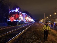 The CP cop keeps watch over to protect & control the crowd from fouling or getting close to the track. CP 01H-28 The Christmas spirt and cheer is in Hamilton, Ontario tonight as the crowd enjoys this year's Holiday train. As these train's brings lots of joy and christmas spirit to each city they stops in. Merry Christmas and Happy Holidays!!