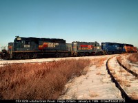 CSX in the late 80's was a "hodge-podge" of power.  Here we have a "Grain Extra" power set sitting in Fargo, Ontario after delivering an 80 car empty grain train to W.G. Thompson in Blenheim, Ontairo.  Power consist is a Seaboard System SD40-2, a Family Lines GP16, a VMV Leasing (ex-Conrail, exx-EL) SDP45, and a Chessie GP40-2 to round out the quartet.  This power was lifted by westbound R321 a little later which had a Chessie GP40-2 on the point, an Seaboard Coast Line (still in black) GP40, and a CSX SD40 for power when it arrived.  Wish it had still been light enough out to have shot that consist leaving that evening!!