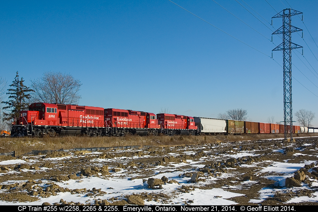 Three of a kind......  CP Train #255 hustles along the Windsor Subdivision with 3 GP20C-ECO units for power.  Nice change from all the regular GE's as of late.
