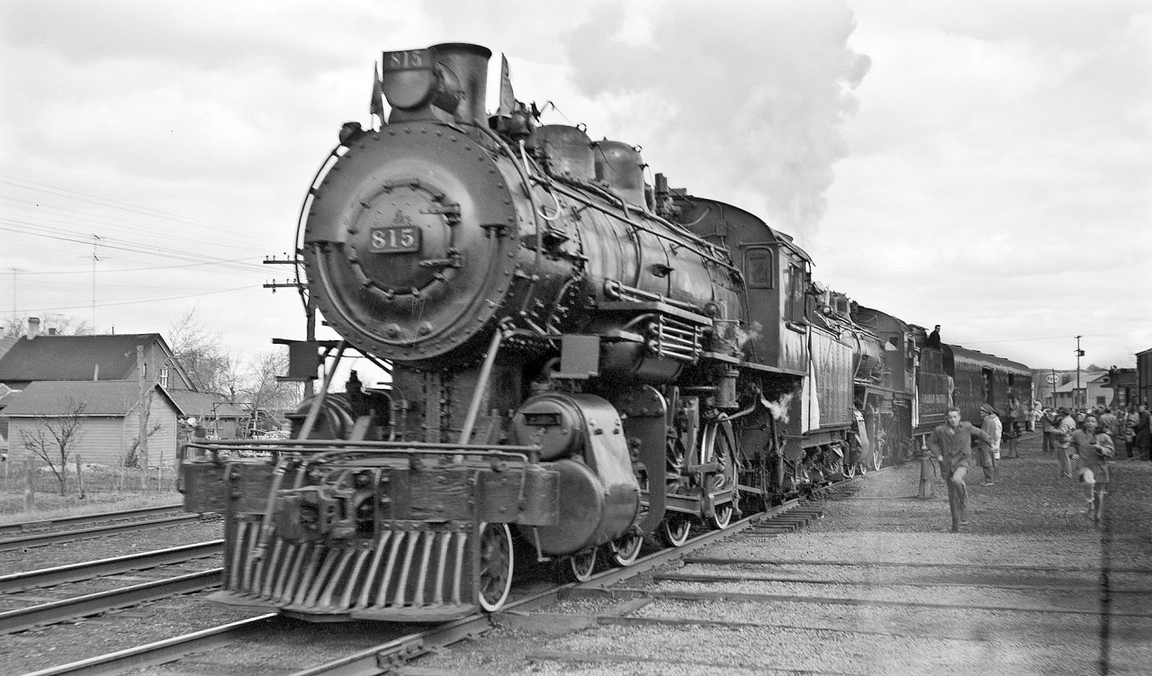 Two youngsters race to get ahead for that all-important shot! 815 and 1057 are switching the consist to marshal equipment for return trip. 136 has already been cutoff to make a brief runpast with just the two wooden coaches at the bottom end of the yard.   

NOTE:  The actual consist of the train went unrecorded. Does anyone know the car numbers?
