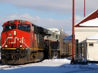 CN 2338 - NS 8101 (Central of Georgia Heritage Unit)lead 393 through Ingersoll, ON after completing a set-off / lift at Beachville